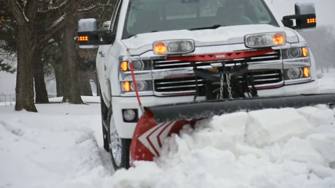 A plow truck clearing accumulated snow